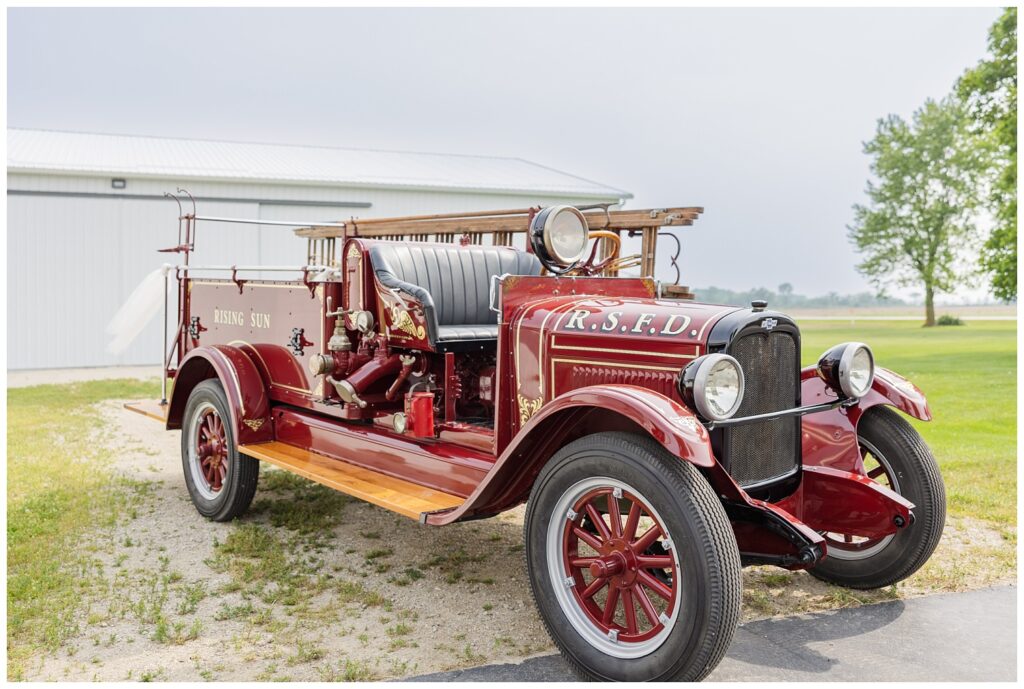 old red vintage Risingsun, Ohio fire truck used for summer wedding ceremony