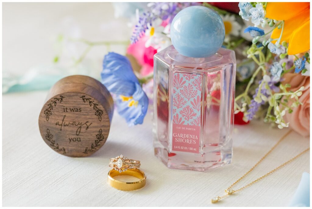 wedding rings and bride's perfume siting in front of bridal bouquet in Fostoria, Ohio