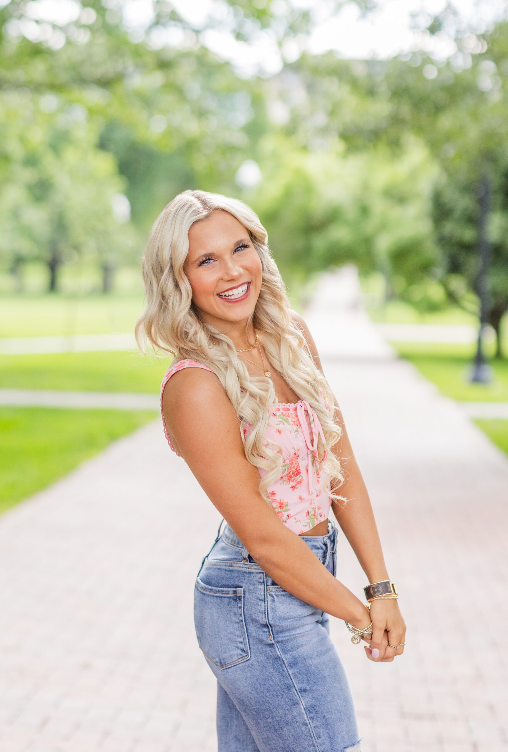 senior girl posing on the oval sidewalk at Ohio State