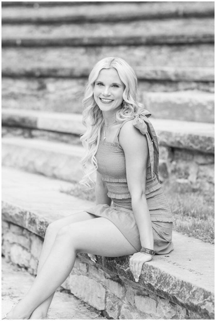 high school senior sitting on the steps of the amphitheater at Ohio State
