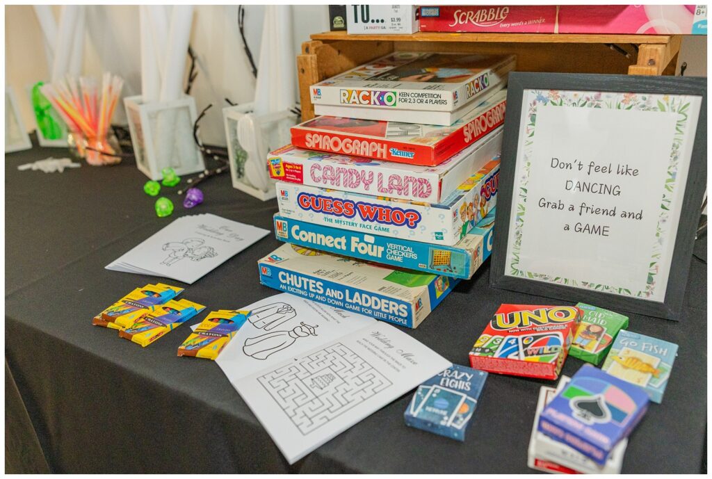 table at wedding reception with board games for guests at Stacy's Place