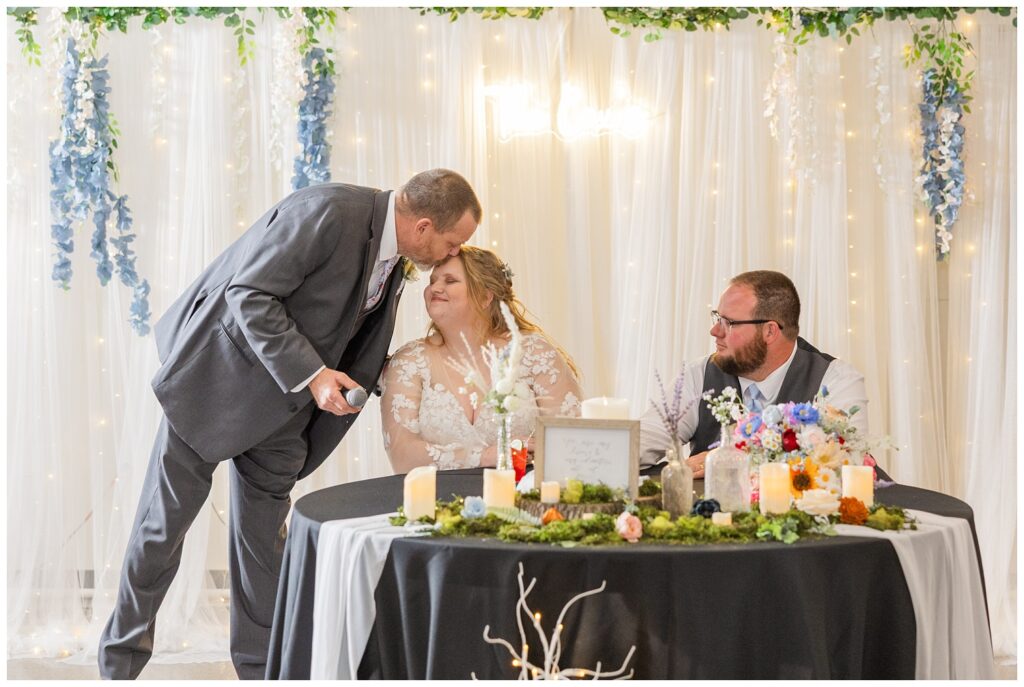 bride's father giving her a kiss on the head after his speech in Fostoria, Ohio