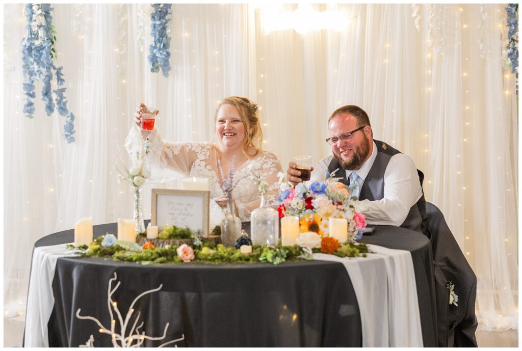 bride and groom toasting to the speech from the maid of honor in Fostoria, Ohio