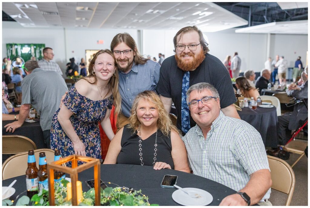 wedding guests smiling at their table at Stacy's Place venue in Ohio