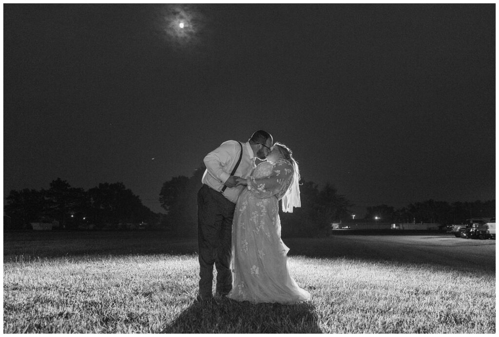 wedding couple kissing under the moon at Stacy's Place in Fostoria