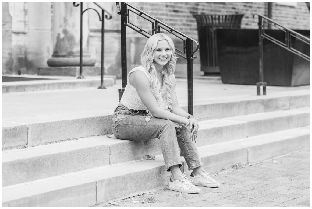 girl sitting on steps at Ohio State campus with Columbus photographer