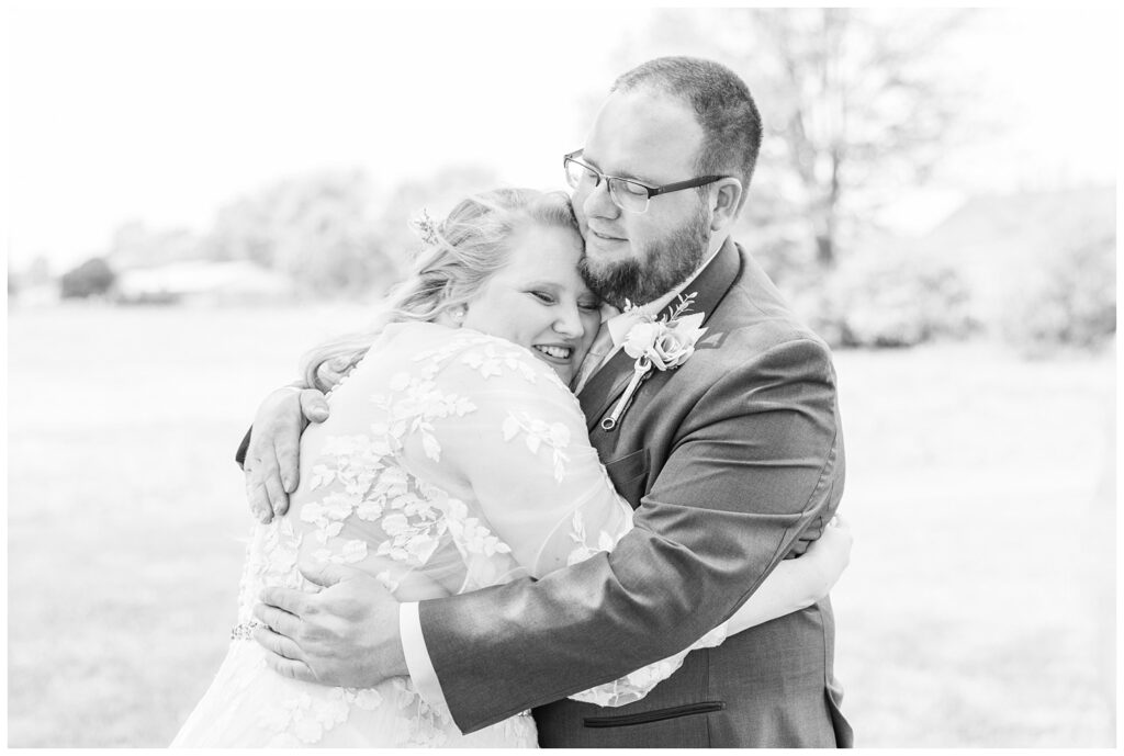 bride hugging her groom after hearing his vows during first look