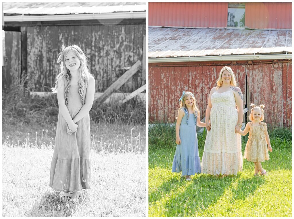 mom holding hands with her two daughters standing in front of a red barn