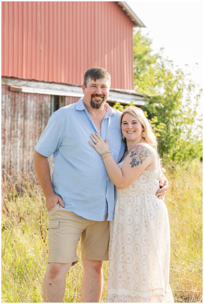 mom and dad posing together in tall grass for Fremont, Ohio family session