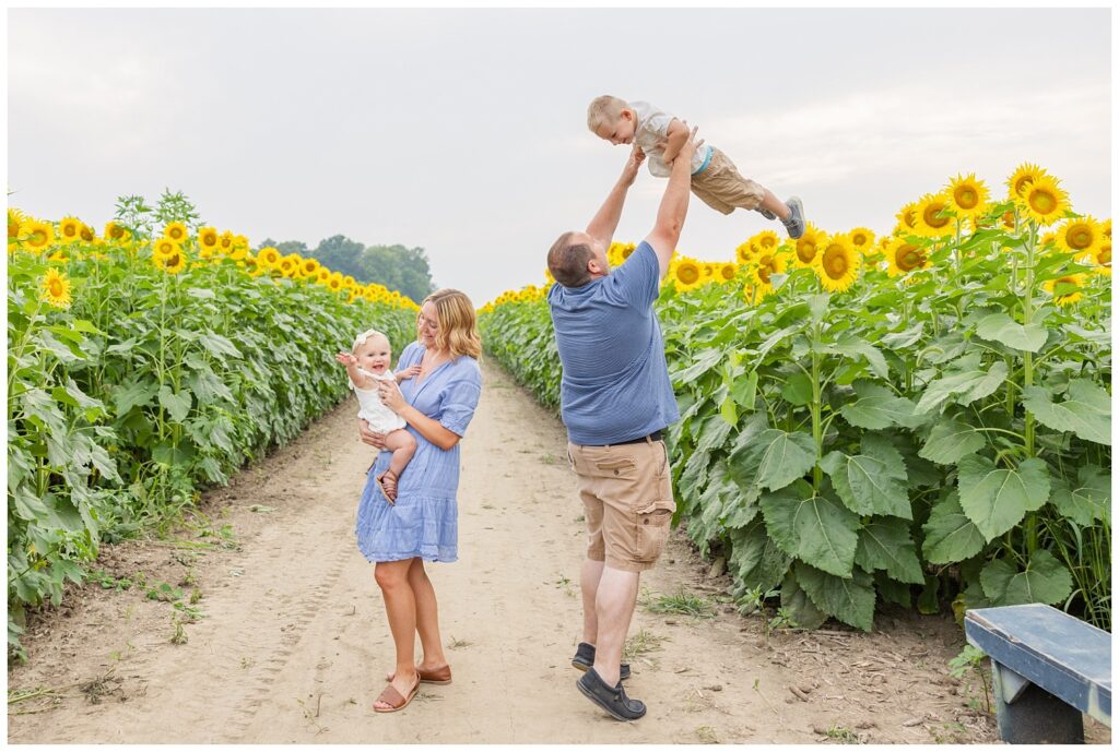 family laughing and having fun at The Suns Flower Farm in Lindsey, Ohio