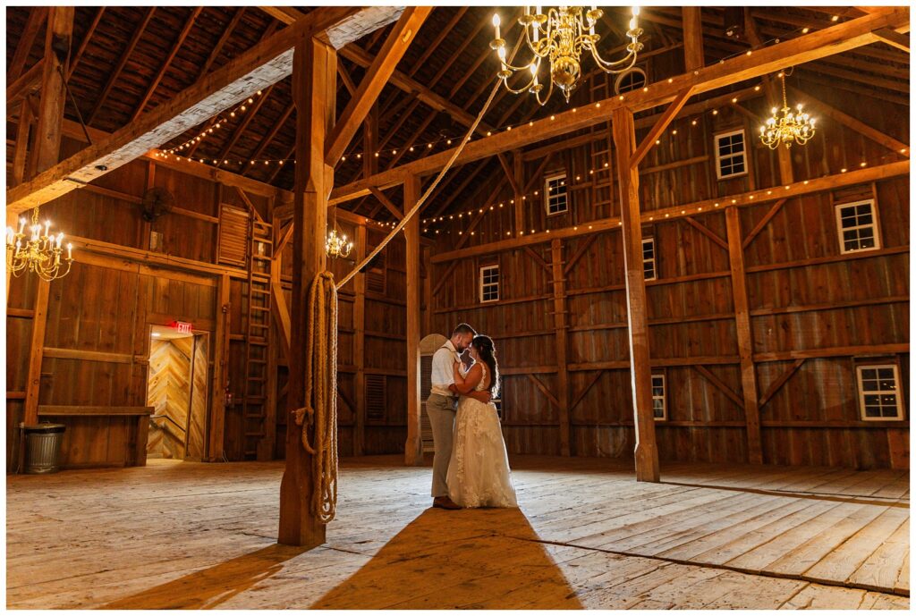 wedding couple having the last dance inside the barn at Arlington Acres venue