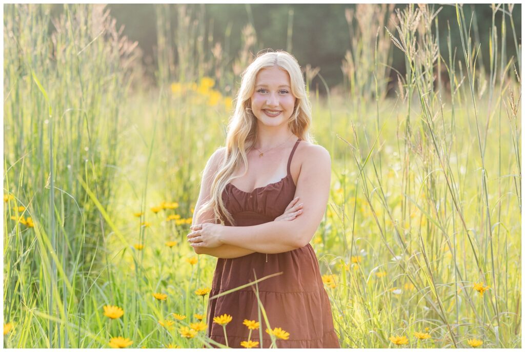 high school senior posing among yellow flowers at Don Miller Park in Ohio