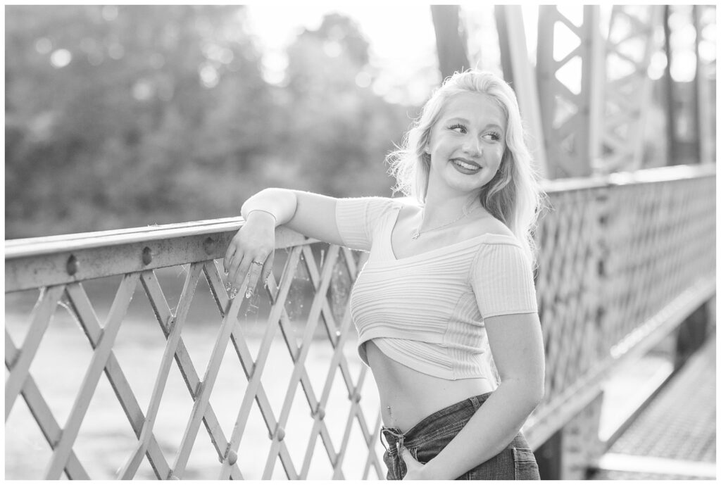 senior girl posing against the bridge in park in Fremont, Ohio