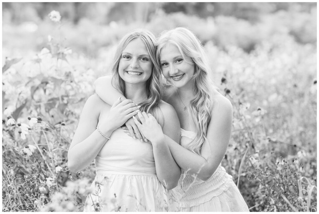 best friends hugging each other in a field for senior session in Fremont, Ohio