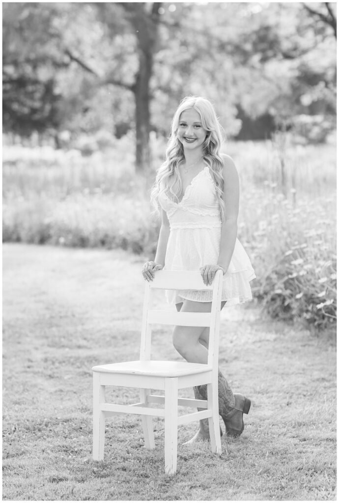 high school senior girl posing with a white chair at Fremont, Ohio session
