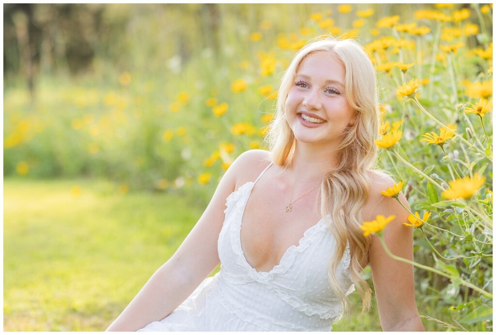 girl smiling and posing against yellow wildflowers at Don Miller Park in Ohio