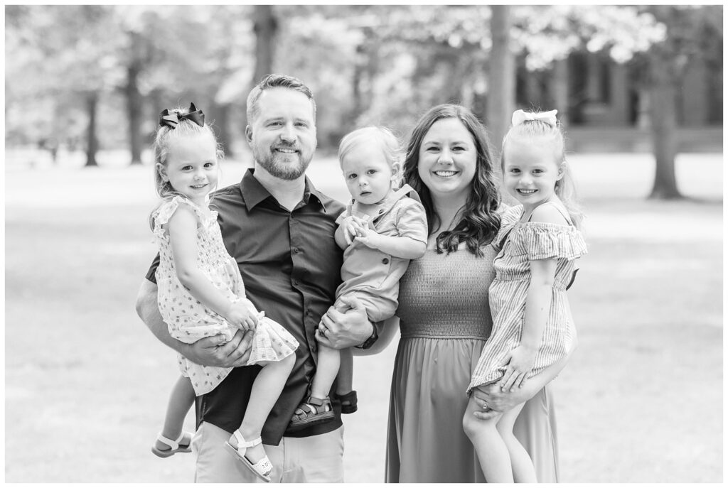 mom and dad holding their three children at the Hayes Center in Fremont, Ohio