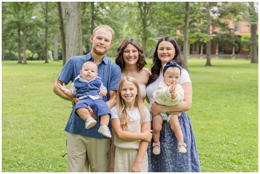 family posing together in front of the Hayes Center in Fremont, Ohio