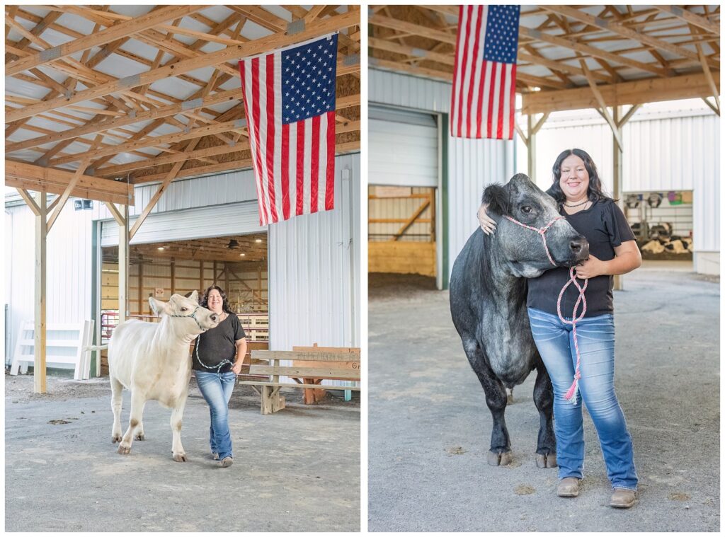 high school senior posing with her large black cow in a white barn