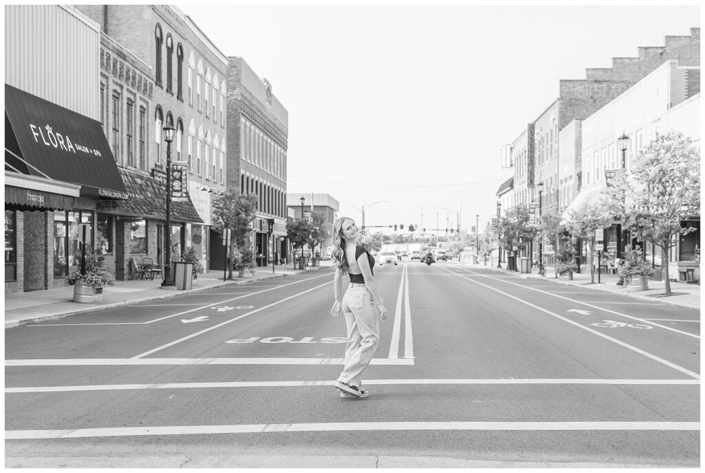 senior walking across the street at Fremont, Ohio session