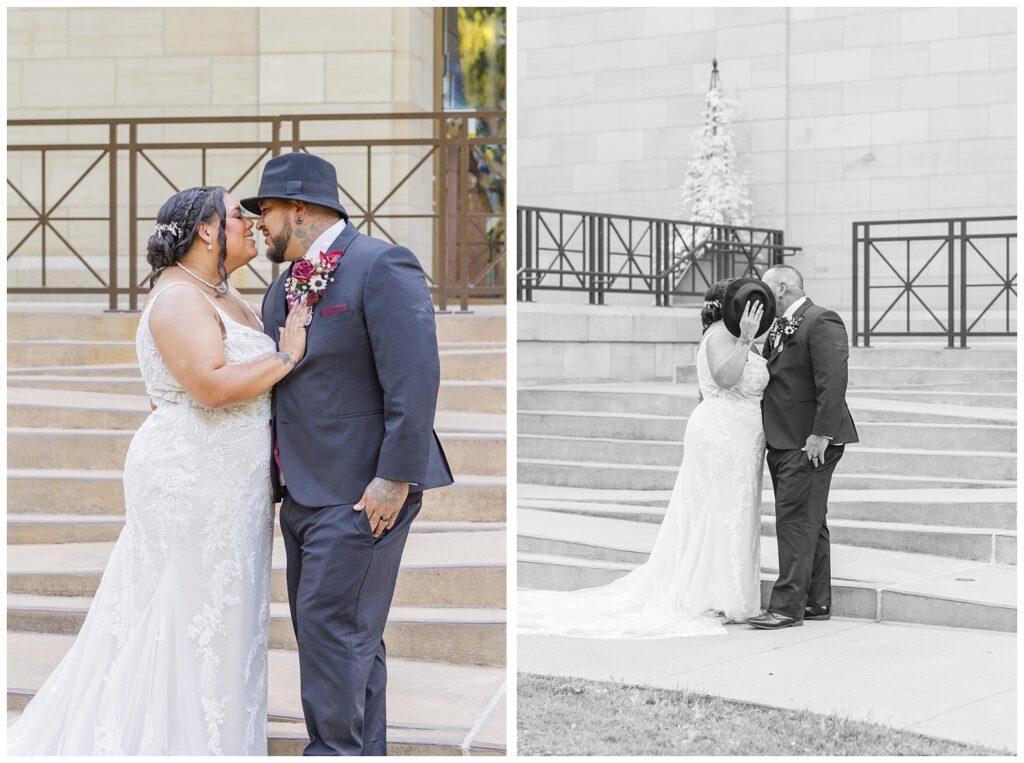 bride and groom sharing a kiss behind a hat at the Hayes Center