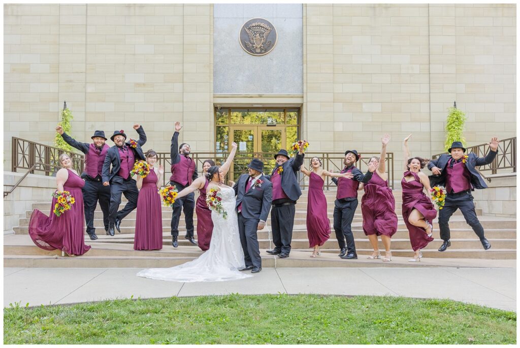 full wedding party jumping and cheering on the ramps at the Hayes Center in Fremont, Ohio