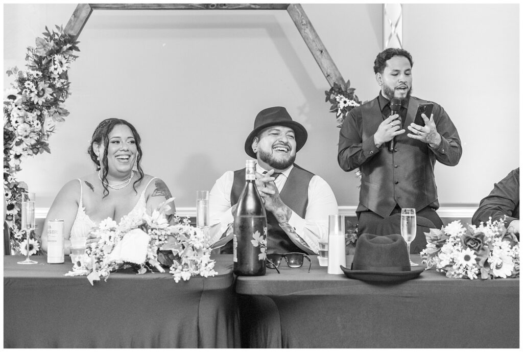 best man delivering his speech at the reception table at the Victor's Center