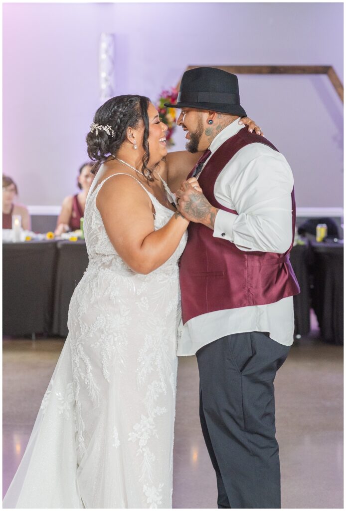 wedding couple have their first dance on the reception floor at the Victor's Center