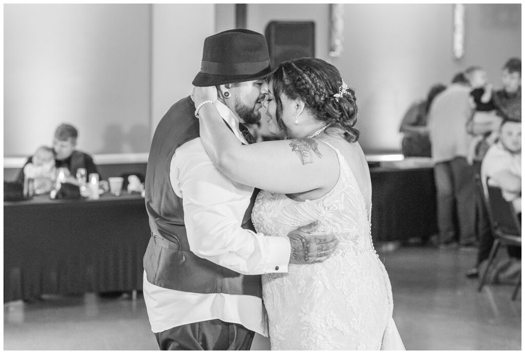 bride and groom touching foreheads as they dance during the reception