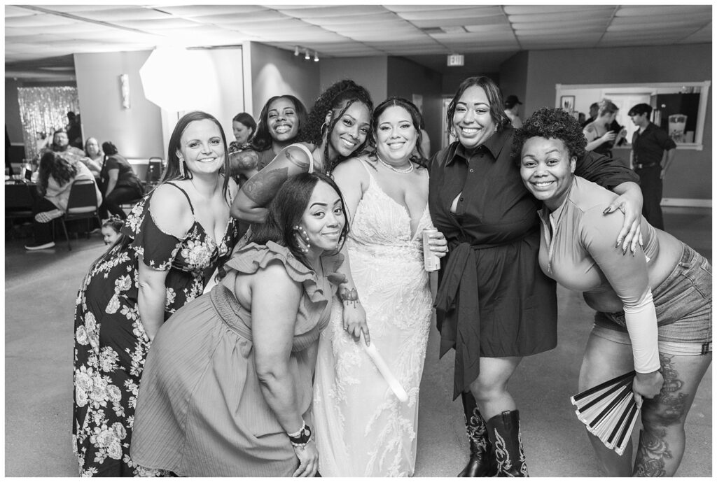 bride posing with her friends at wedding reception at Fremont, Ohio venue