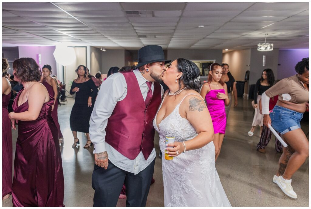 bride and groom sharing a kiss on the dance floor at Fremont, Ohio wedding reception
