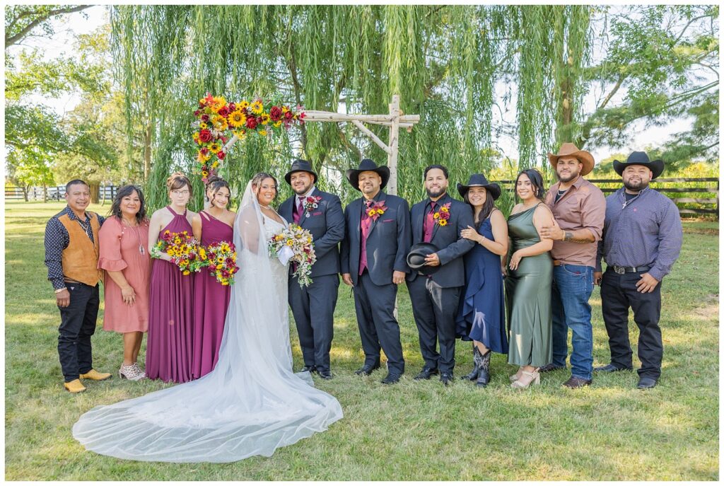 family portraits with bride and groom at the outdoor altar at the Christy House