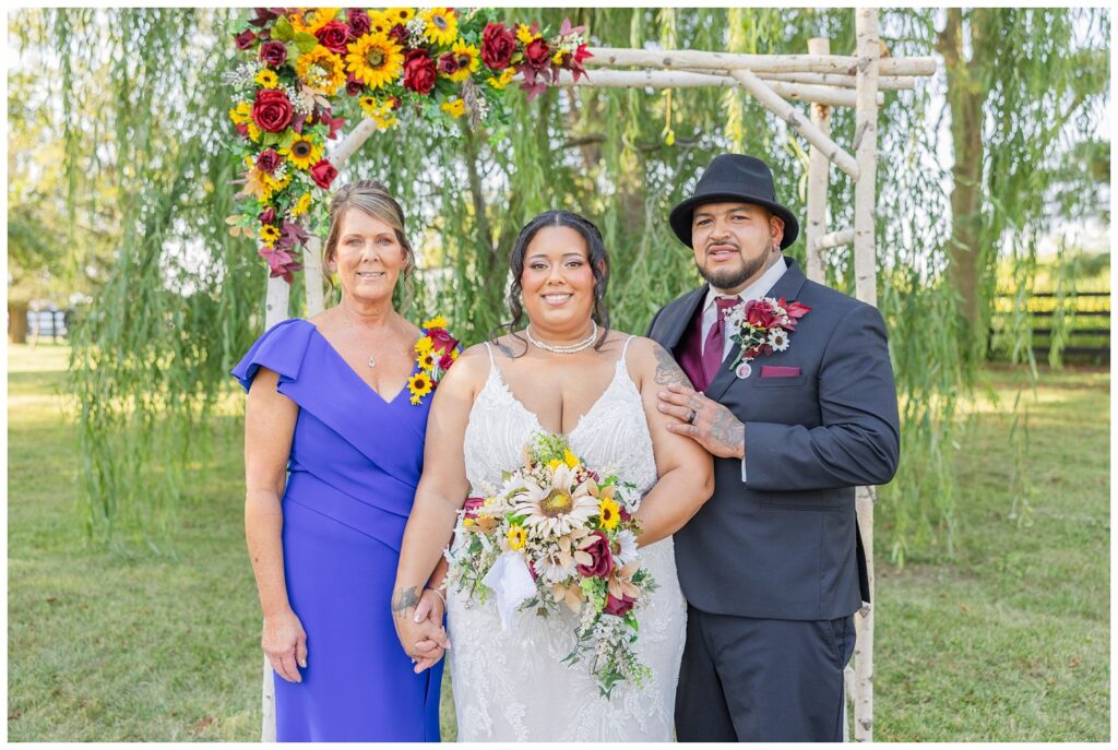 family portraits with bride and groom at ceremony site at the Christy House