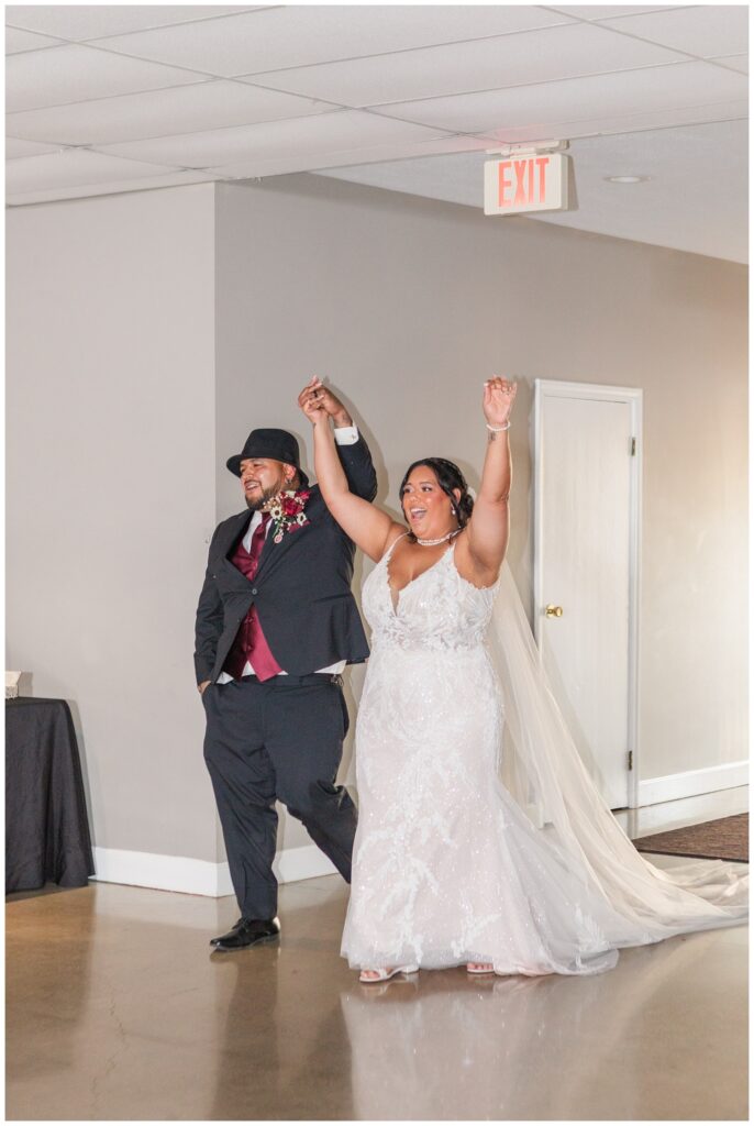 bride and groom emerge into the wedding reception at the Victor's Center in Fremont, Ohio