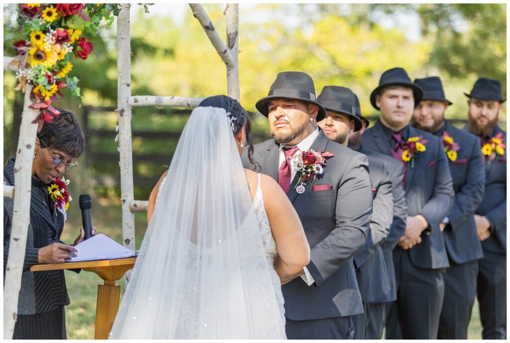 groom saying his vows to the bride in outdoor ceremony in Fremont,, OHio