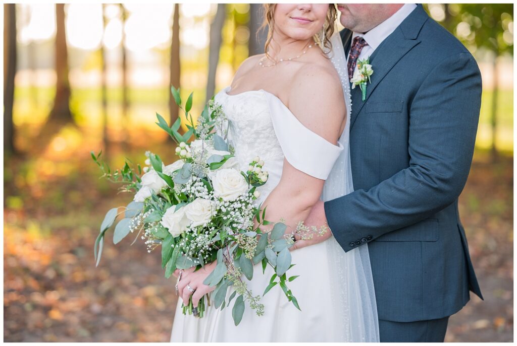 close up of the white and green bridal bouquet that the bride is holding at Tiffin, Ohio wedding venue