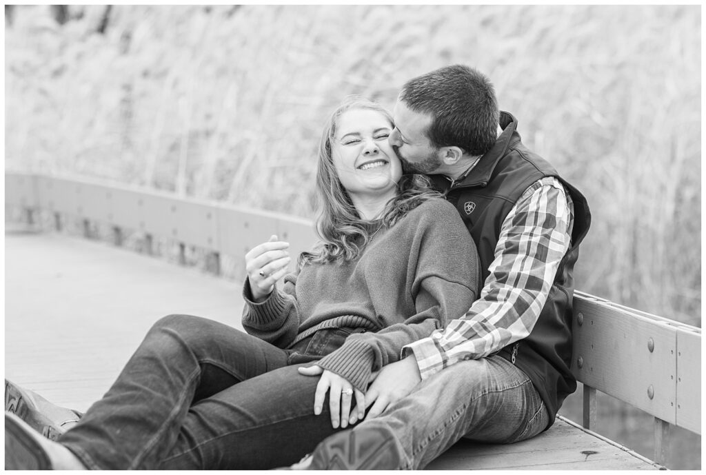 couple sitting together on a walkway next to tall grass in Tiffin, Ohio at Heidelberg University