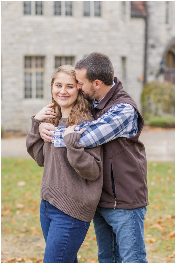 engaged couple hugging on the campus of Heidelberg University in Tiffin, Ohio