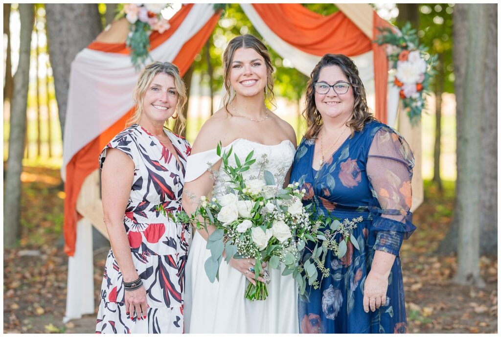 Tiffin, Ohio wedding photographer taking portraits of the bride, her mom, and mother in law