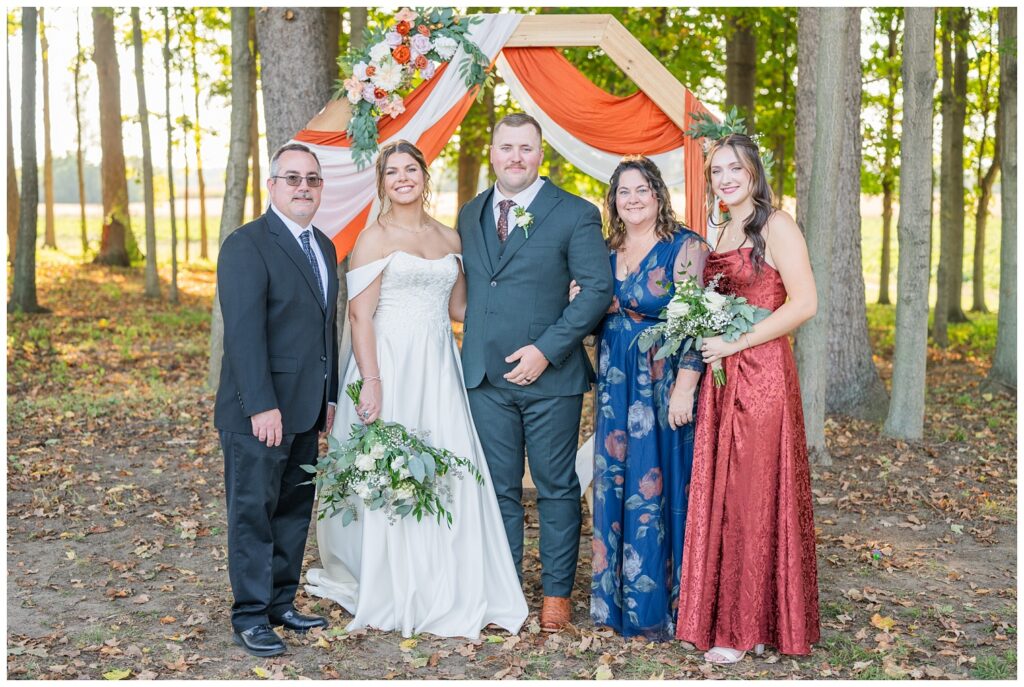 portraits pf groom's family at the ceremony site outdoors at the Octagon House venue