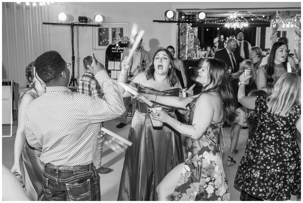 Fremont, Ohio wedding photographer taking portraits of fall reception outside 