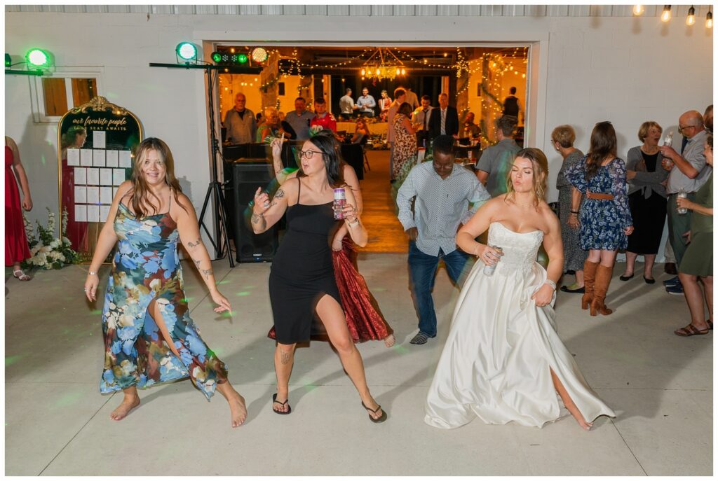 bride doing a line dance with wedding guests at the Octagon House in Tiffin, Ohio