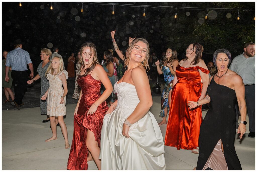 bride dancing with her friends at fall wedding reception in Tiffin, Ohio