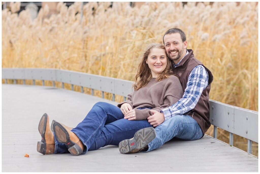 couple sitting together on a walkway next to tall grass in Tiffin, Ohio