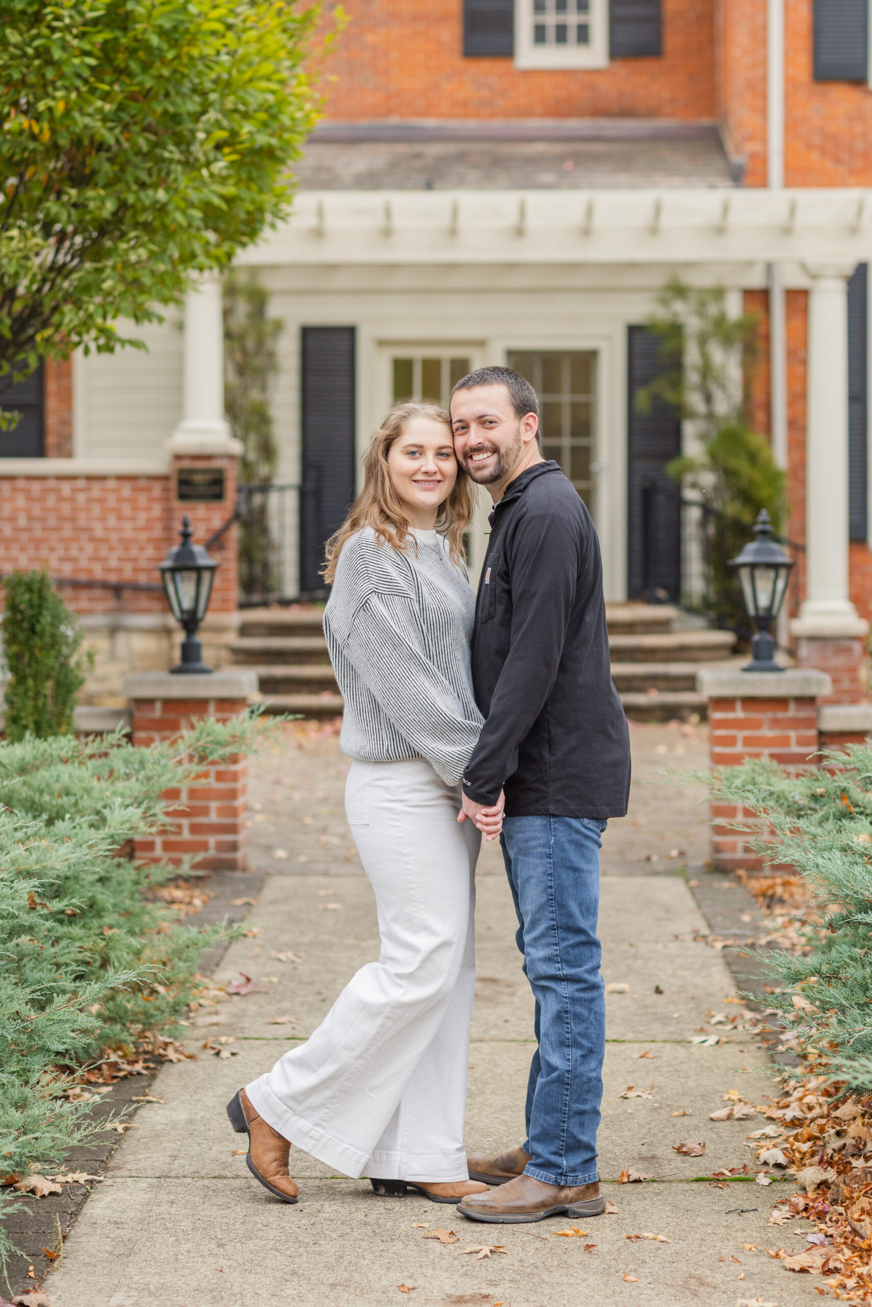 engaged couple posing at university in Tiffin, Ohio