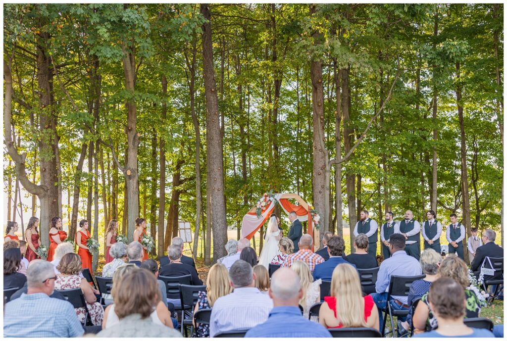 wedding guests watching the bride and groom get married at the Octagon House venue
