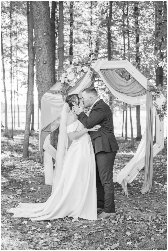 groom kissing the bride at the end of the ceremony in Tiffin, Ohio venue