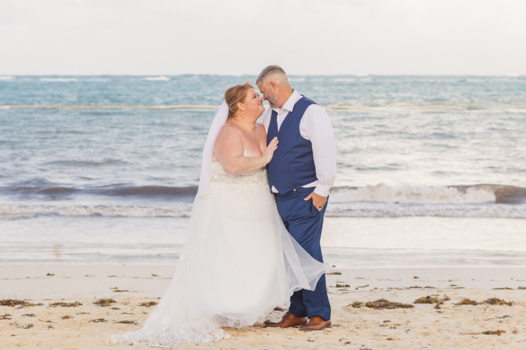 bride and groom posing for portraits on the beaches of Punta Cana