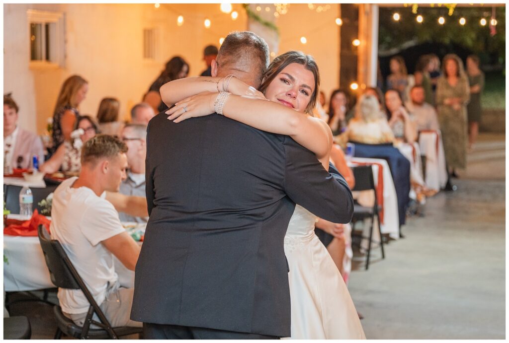 bride hugging her dad at the end of their dance during the reception with Tiffin, Ohio photographer