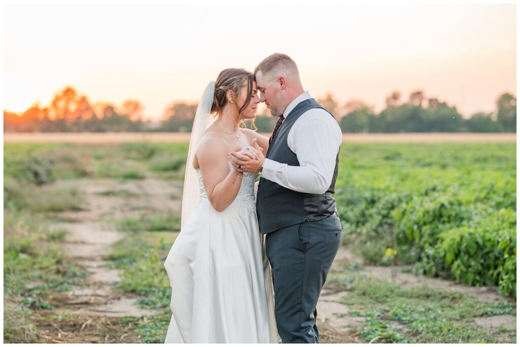 wedding couple dancing outside to the sunset in the background in Tiffin, Ohio